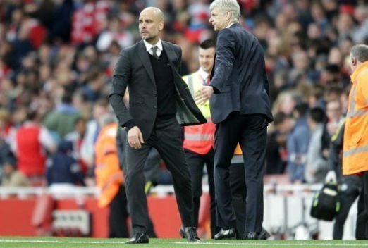 Arsene Wenger and Pep Guardiola on the touchline.