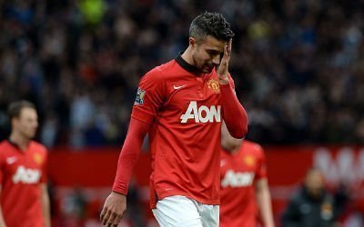 Robin van Persie looks dejected after another loss for Manchester United
