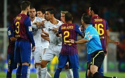 Barcelona Vs Real Madrid matches have boiled over in the past, here Ronaldo is held back by team mates.