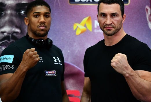 Anthony Joshua and Wladimir Klitschko posing side by side.