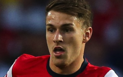 Aaron Rsmey celebrates scoring a goal against Stoke City for Arsenal