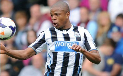 Loic Remy controls the ball with his chest during a game for Newcastle