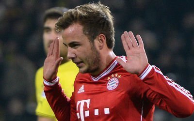 Mario Gotze holds his hands up after scoring, presumably against old club Borussia Dortmund.