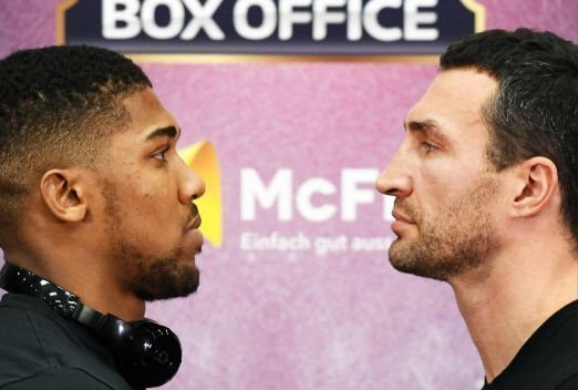 Joshua and Klitschko squaring up each other face to face.